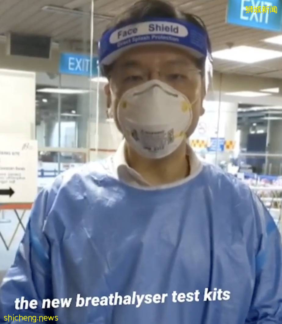 新加坡部长身穿防护服+口罩面罩发视频:情况变得越来越好