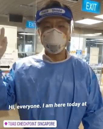 新加坡部长身穿防护服+口罩面罩发视频:情况变得越来越好