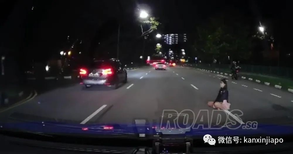 女子半夜盘坐马路中央，怎么喊也不离开