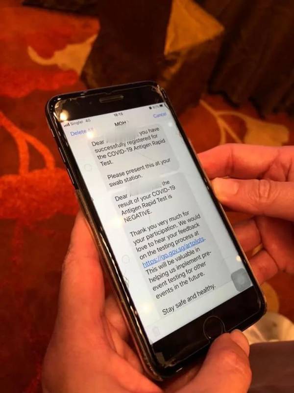 新加坡试行大型活动国际能源周,贸工部长亲自体验快速抗原检测,15分钟出结果