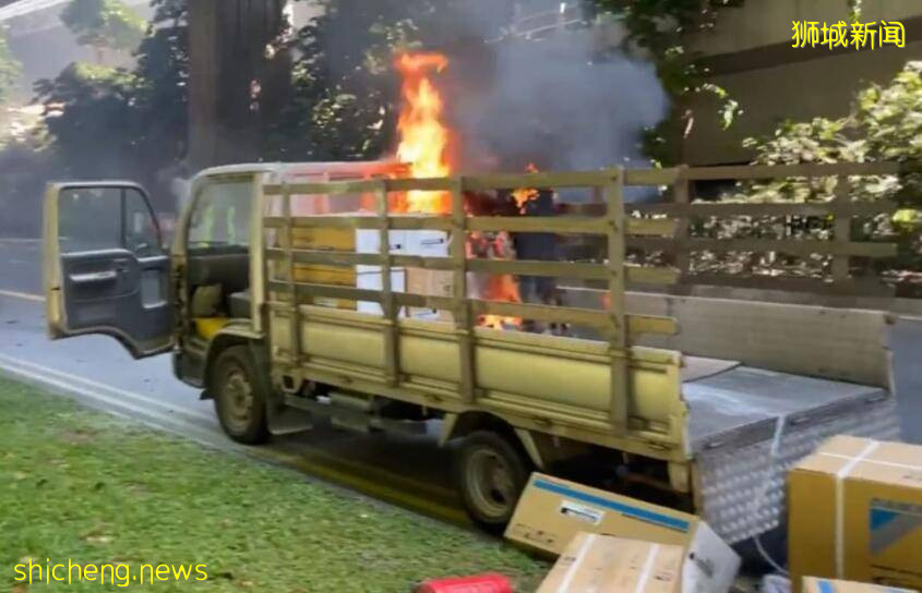 新加坡一辆大货车突然着火，附近司机赶忙救人、“红犀牛”火速到场瞬间灭火