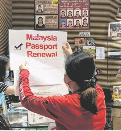 狮城相馆可更新大马护照？  经理澄清:助上网申请非代理