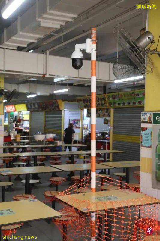 为减少食客违规聚集  熟食中心安装了这个